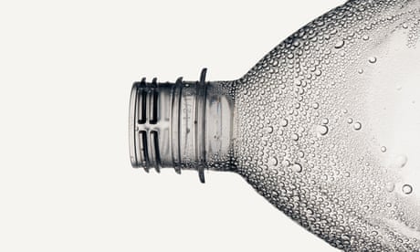 A plastic water bottle without a cap that has condensation on it<br>GettyIm2ages-164848718