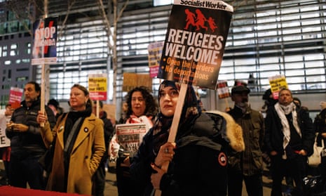 Pro-immigration campaigners with 'refugees welcome' placards outside the Home Office in December