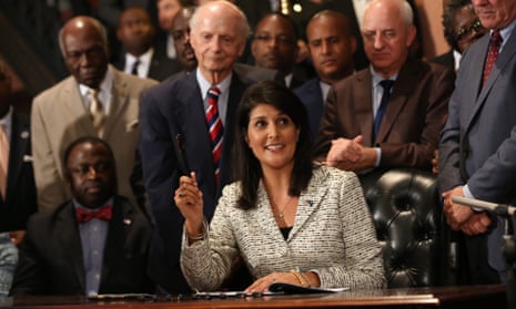 Nikki Haley, then governor of South Carolina, signs into law a bill removing the Confederate flag flying at the state house in Columbia, on 9 July 2015.