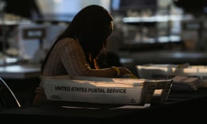 An employee of the Fulton County Board of Registration and Elections processes ballots in Atlanta, Georgia.