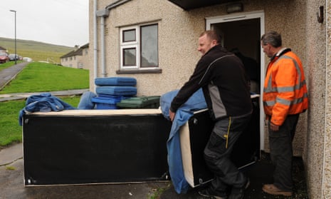 Furniture is moved out of a housing association house to make way for a new tennant, Yorkshire.