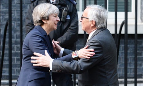 Theresa May greeting EC president Jean-Claude Juncker