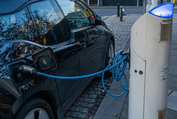 A car plugged in at an electric charging point in Wimbledon village.