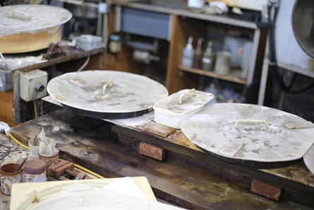 A workbench with vinyl moulds on it
