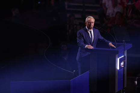 Man rests hands on a podium he's behind