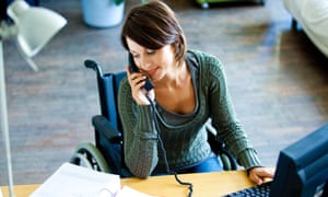 Woman in wheelchair working.