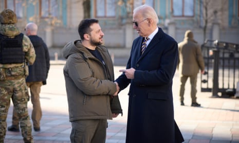US President Joe Biden walks next to Ukrainian President Volodymyr Zelenskiy as he arrives for a visit in Kyiv on Monday.