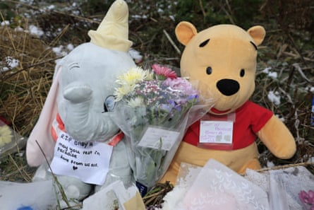 Stuffed toys with messages of condolences to the deceased baby.