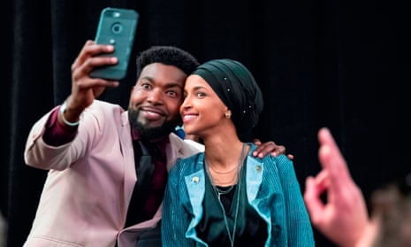 Ilhan Omar celebrates with one of her supporters after winning Minnesota for the Democrats 