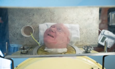 Paul Alexander, reflected in a mirror attached to his iron lung, Thursday, September 12, 2019, in his apartment in Dallas, Texas.