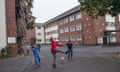 Children play football outside the occupied Cissie Gool House in Woodstock, Cape Town.