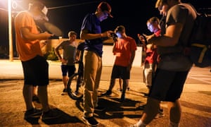 A group of teenagers playing Pokémon Go.