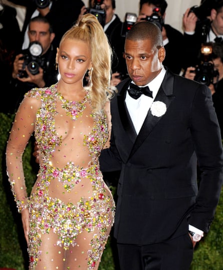 Beyoncé in see-through dress described as a vajazzled nude body sock with Jay-Z in a tux