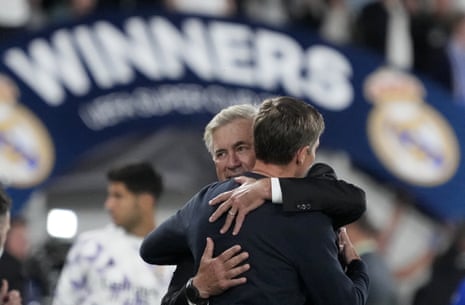 Real Madrid's head coach Carlo Ancelotti hugs with Frankfurt's head coach Oliver Glasner at the end of the UEFA Super Cup final.