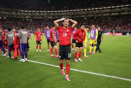 Oh Hyeon-gyu has his hands on his head after South Korea’s comeback win against Czechia