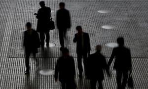 Silhouette of people at an office building