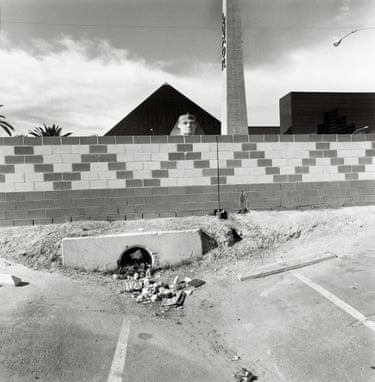 Lee Friedlander, Las Vegas, 1997. In the early 1990s, Friedlander made a significant shift, and began to shoot with a Hasselblad Superwide in addition to his trusty Leica. Here, the square format collapses space to emphasize the scene’s inherent contrasts. Behind a drainage ditch clogged with debris, the Luxor casino rises. The stucco sphinx peers over the parking lot wall in a spectacle engineered for the frame, each element equally weighted and equally strange.