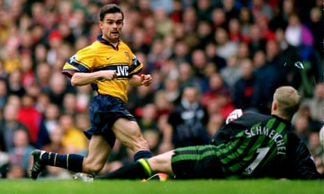 Marc Overmars scores Arsenal’s 79th-minute winner against Manchester United at Old Trafford on 14 March 1998 which swayed the title race in the Gunners’ favour.