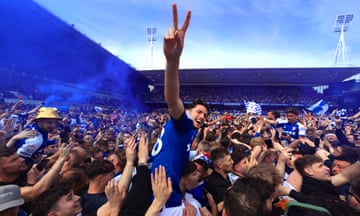Lewis Travis, his teammates and the Ipswich Town fans celebrates promotion to the Premier League on the Portman Road pitch.