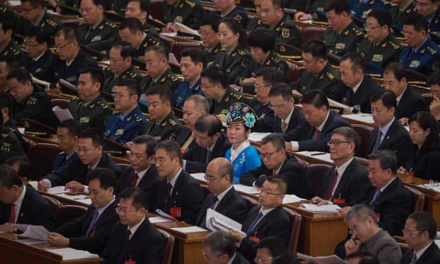Delegates listen to Chinese president Xi Jinping’s address.
