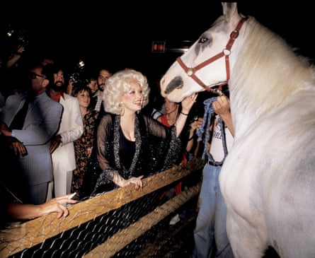 Dolly Parton with a white horse during a party at Studio 54, May 1978