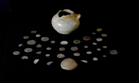 The collection of coins presented on a black canvas