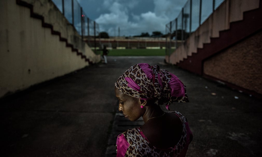 A woman stands close to where she was arrested and abused by security forces.