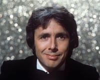A headshot of Richard O’Sullivan looking at the camera, dressed in black tie