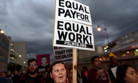 An activist seen holding a placard that says equal pay for equal work during the International Women’s Strike in Los Angeles. 
