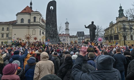 Participants attend the Christmas Stars Festival outside Taras Shevchenko monument, on the Orthodox second day of Christmas, in Lviv, Ukraine, on 8 January 2023.