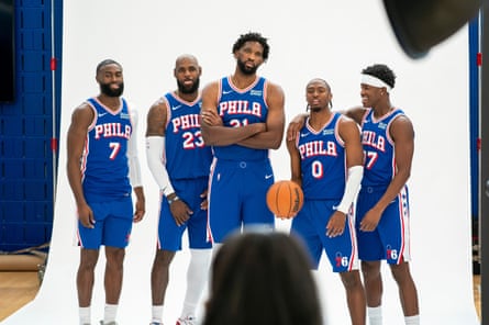 LeBron James poses with his new 76ers teammates during a media day photoshoot.