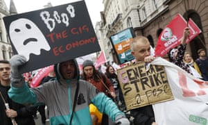 Workers and supporters protest outside the Royal Courts of Justice during hearings over the rights of Uber drivers, October 2018.