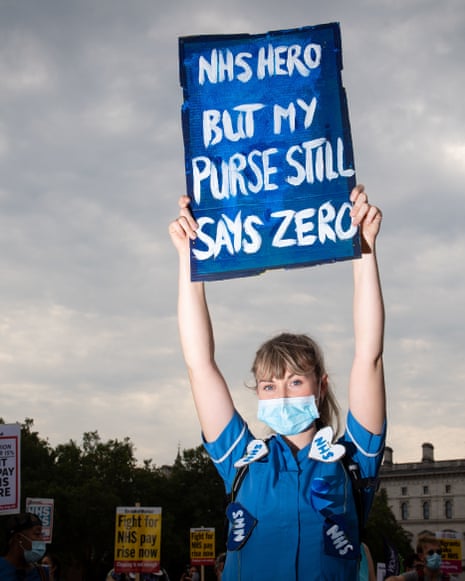 NHS workers march from St. James Park to Downing Street, London, as part of a national protest over pay.