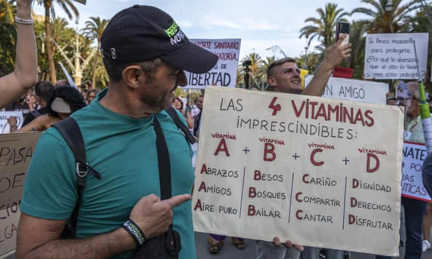 A protester with an anti-vaccine placard at a demonstration of Covid-deniers in Barcelona in July 2021.