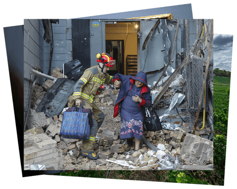 A rescuer helps a local woman at the site of a Russian missile strike on a residential area in Kyiv, Ukraine.