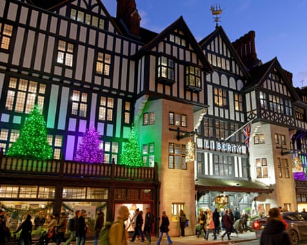 View of the Liberty department store London with colourful Christmas decorations at night