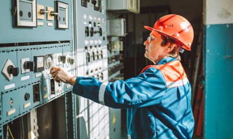 Senior woman, engineer-technician, operating complex equipment on electrical dispatching station