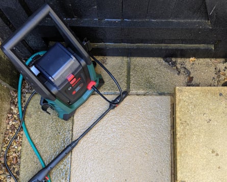 A patio slab after the Bosch UniversalAquatak 36V-100 pressure washer has cleaned it
