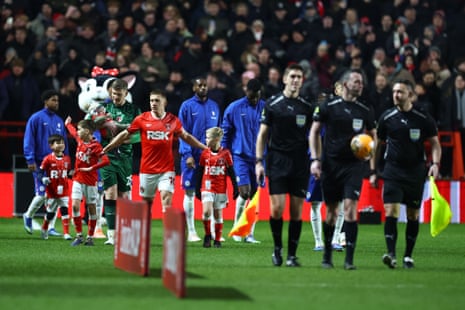 Greg Docherty of Charlton Athletic leads his team out.