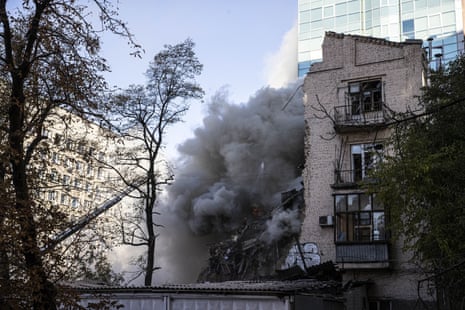 Smoke rises from a destroyed building after Russian attacks in Kyiv this morning.