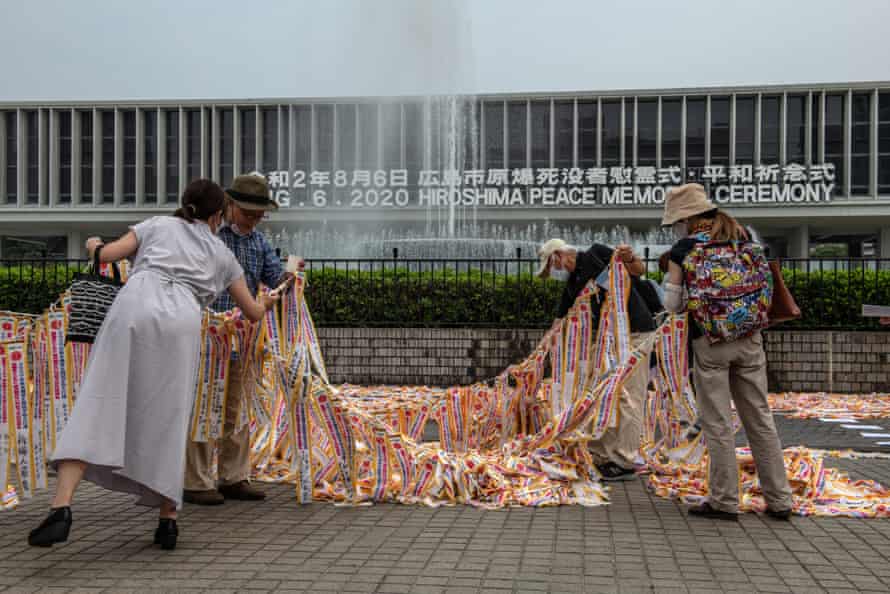 Peace activists arrange ribbons near the Hiroshima memorial museum. About 140,000 people were killed in the bombing.