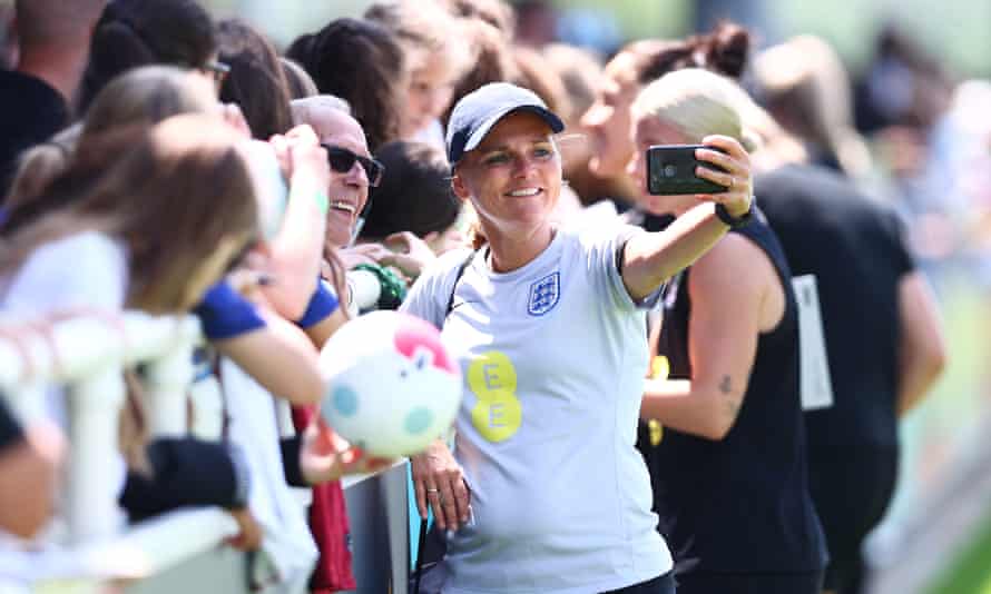 The England manager Sarina Wiegman mixes with fans at their St George's Park training base.