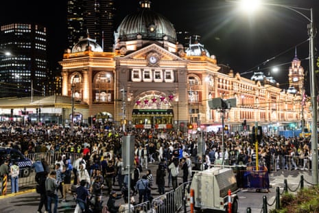 People crowd the St Kilda Road during New Year’s Eve celebrations in Melbourne, Australia.