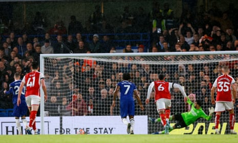 Chelsea's Cole Palmer sends Arsenal keeper David Raya the wrong way to open the scoring.