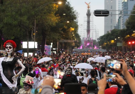 Citizens participate in the traditional parade in honor of La Calavera (The Skull) Catrina, a character first conceived by Mexican artist Jose Guadalupe Posada.