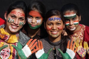 Girls prepare to welcome the New Year in Amritsar in India.