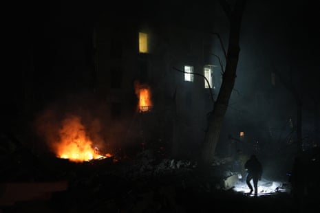 A rescuer shines a torch during a search and rescue operation in Kramatorsk, Ukraine. Three people died, eight people were hospitalised with injuries, two are in serious condition.