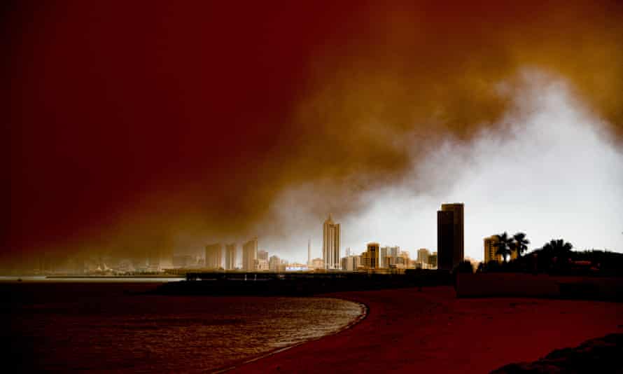 Heavy dust storm advances towards the shore in Kuwait City on 23 May