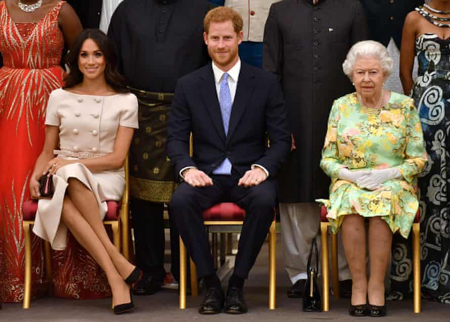 The Duchess of Sussex with Prince Harry and the Queen.