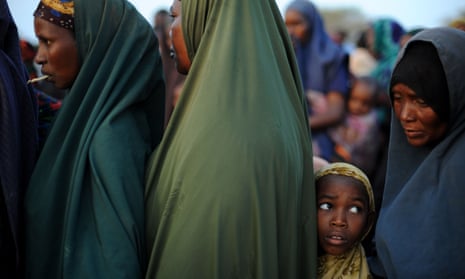 Women and children queue up for food at Dadaab, the world’s largest refugee camp which the Kenyan government is threatening to close.
